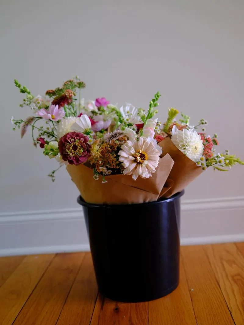 bucket of wrapped flower bouquets