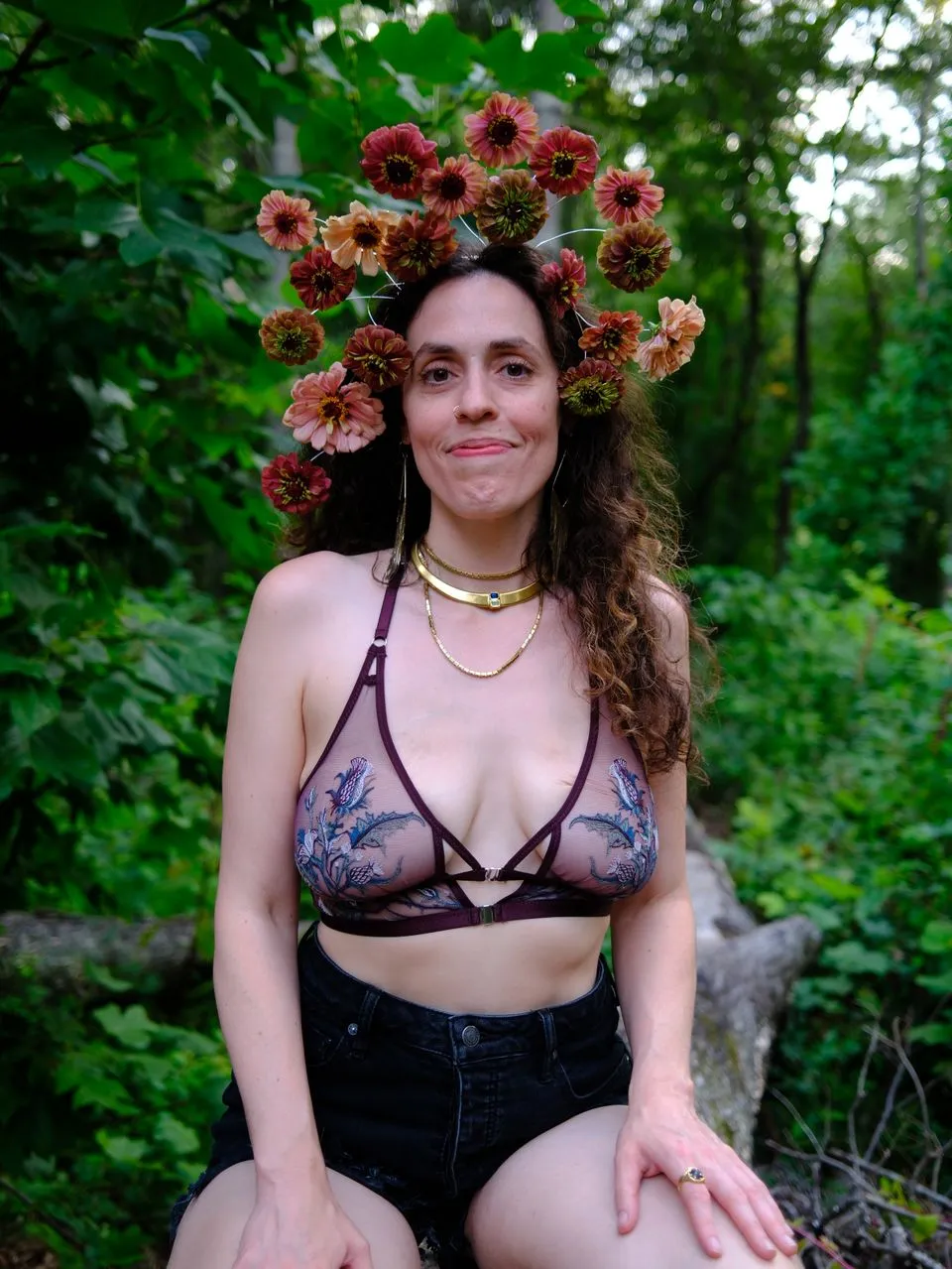 woman in peach dress on coastal mountain dancing with silk fans